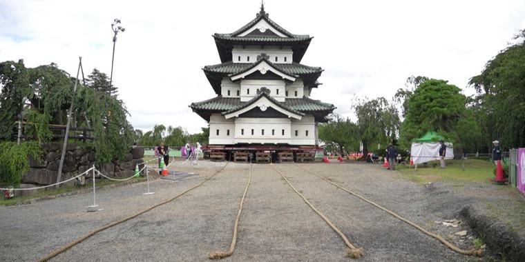 People pull Japan's historic Hirosaki Castle back into place