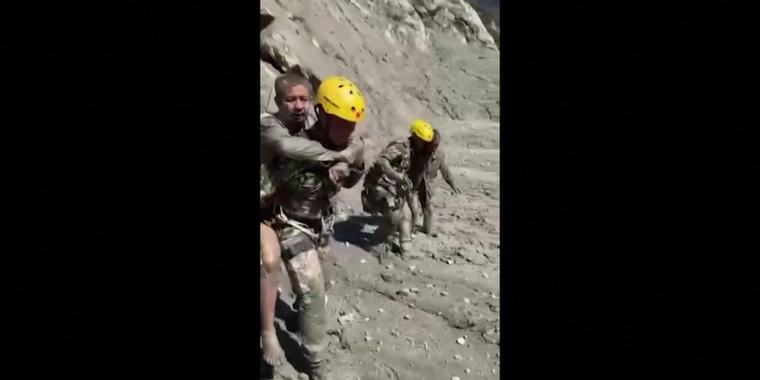 Nepal orders rescuers to safety as overflow brings new flood risks